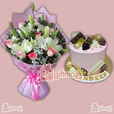 send beautiful assorted lilies and roses arrangement with tasty fresh fruits flavor cake