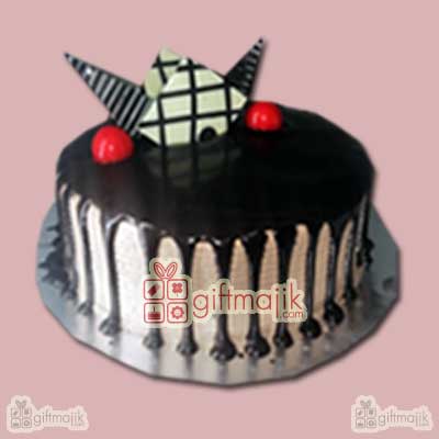 Send online delicious Choco Vanilla cake with chocolate garnishing on top